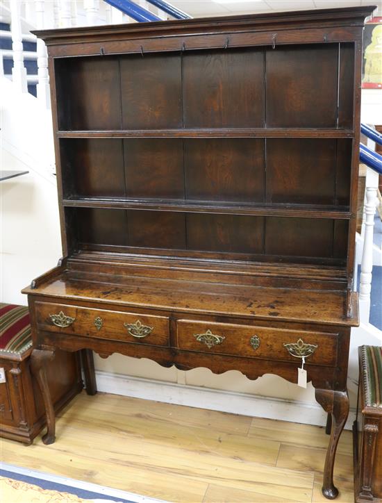 An 18th century oak dresser with boarded plate rack over W.137cm H.177cm